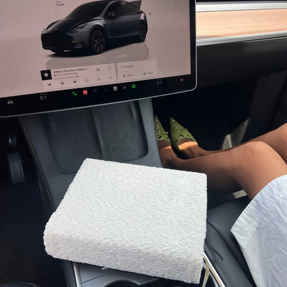Person sitting inside a Tesla vehicle with the Kainos bare white Boucle bible cover on a She Reads Truth Bible