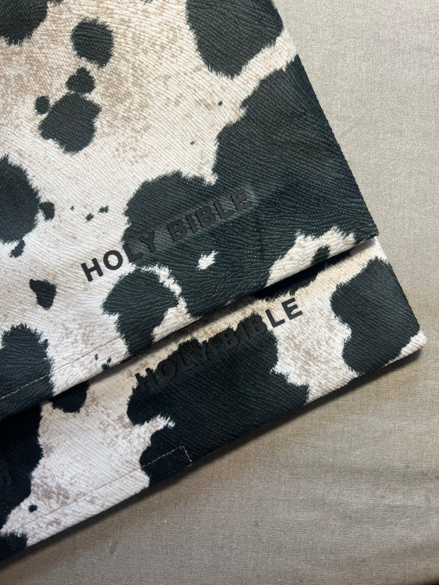 REDEEMED BLACK COW PRINT BIBLE COVER