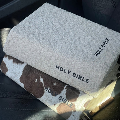 Holy Bible in a car with a cow print cover