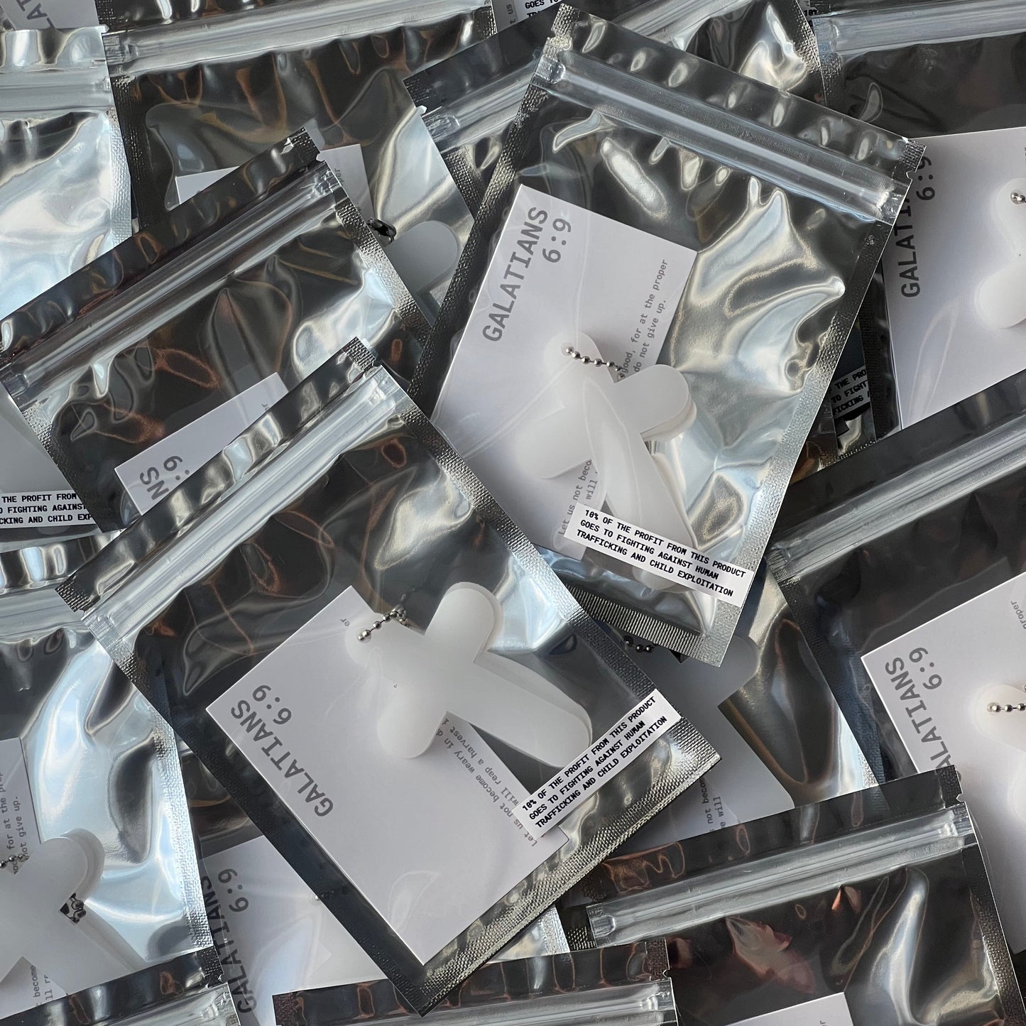 MILKLY WHITE CROSS KEYCHAIN