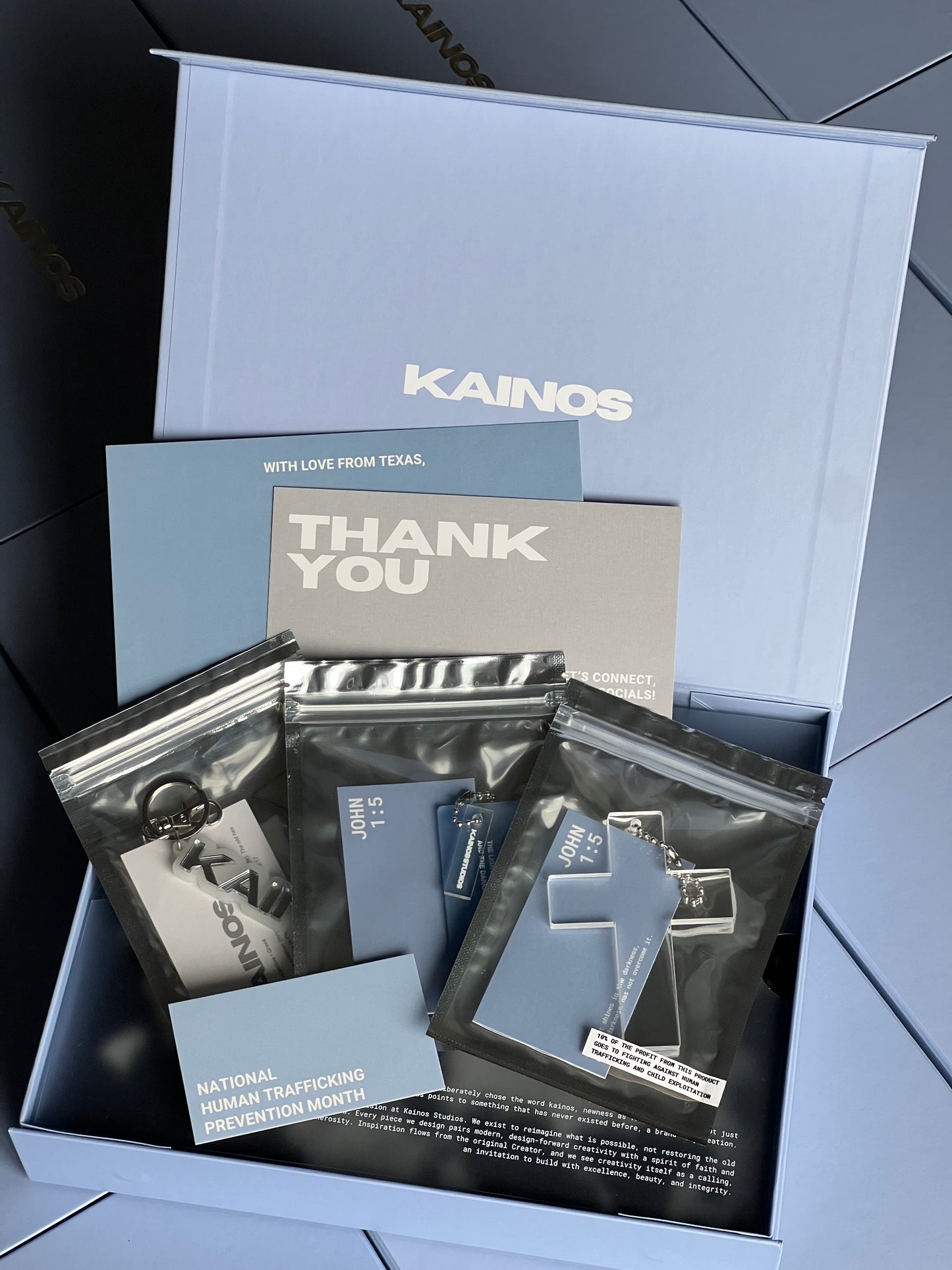 Product packaging with 'Kainos' branding on a tiled floor background